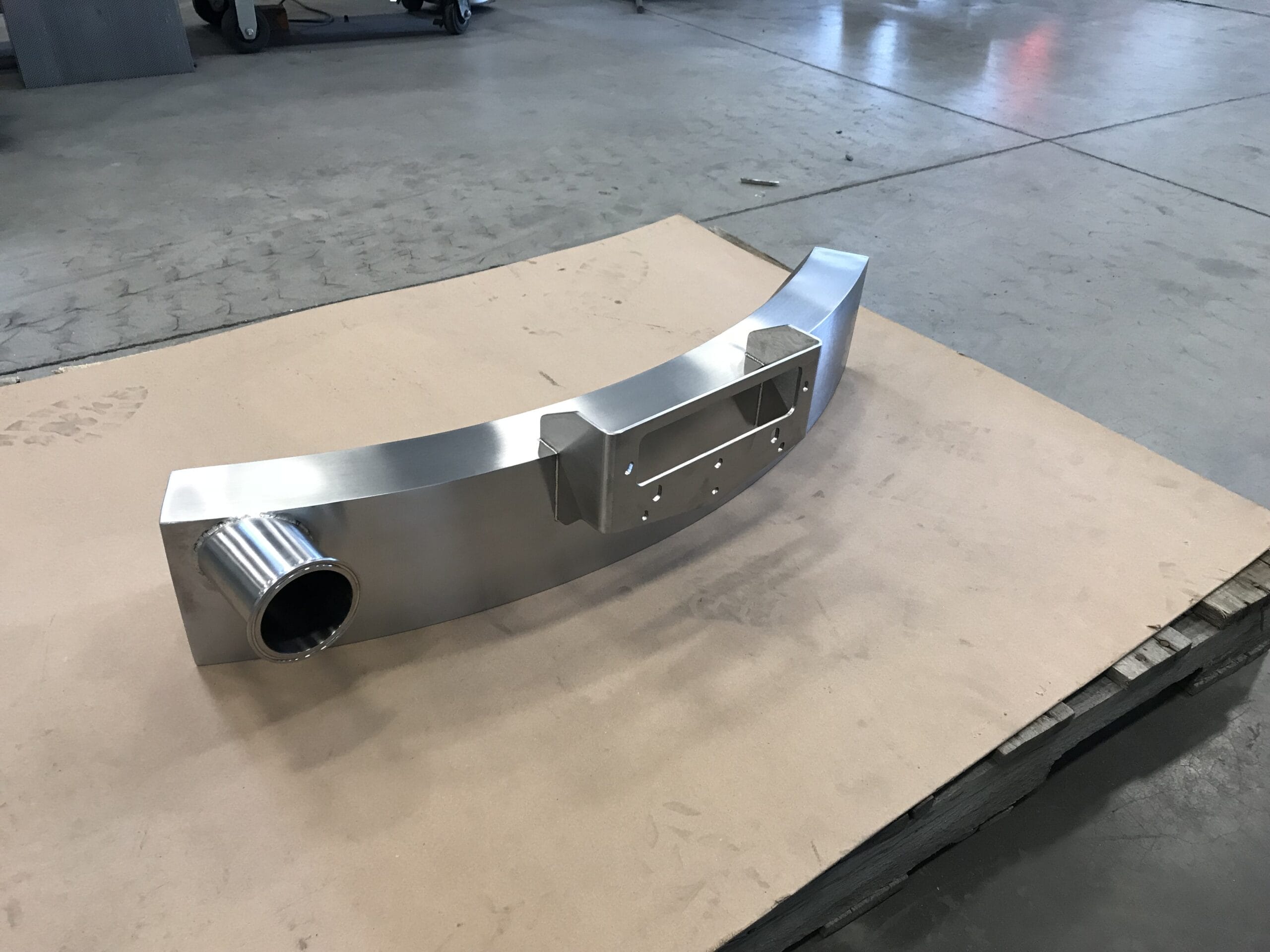 Overflow box with blended welds and ground finish.