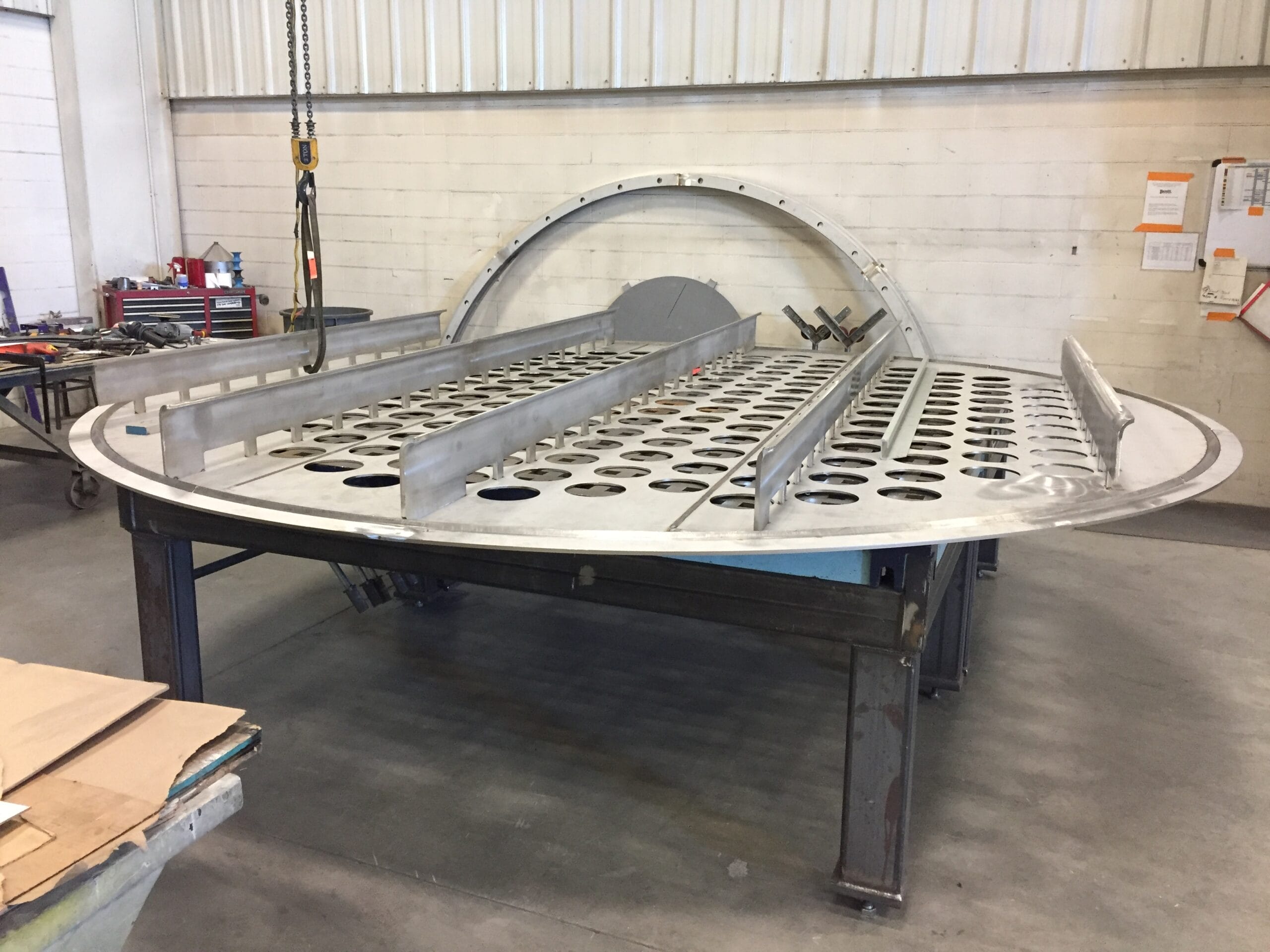 Dairy baghouse tube sheet with 3-A sanitary top surface and ground/polished plenums (clean and dirty air sides).