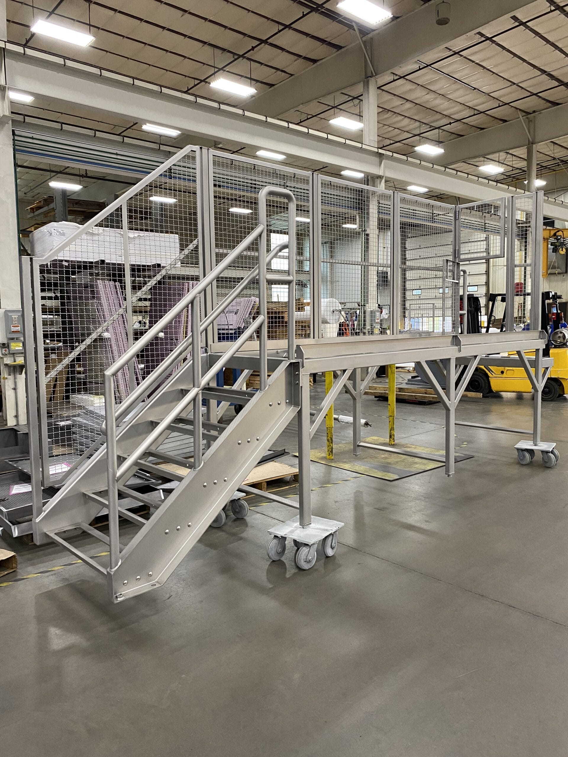 Fabricated stainless working platform with structural reinforcement.