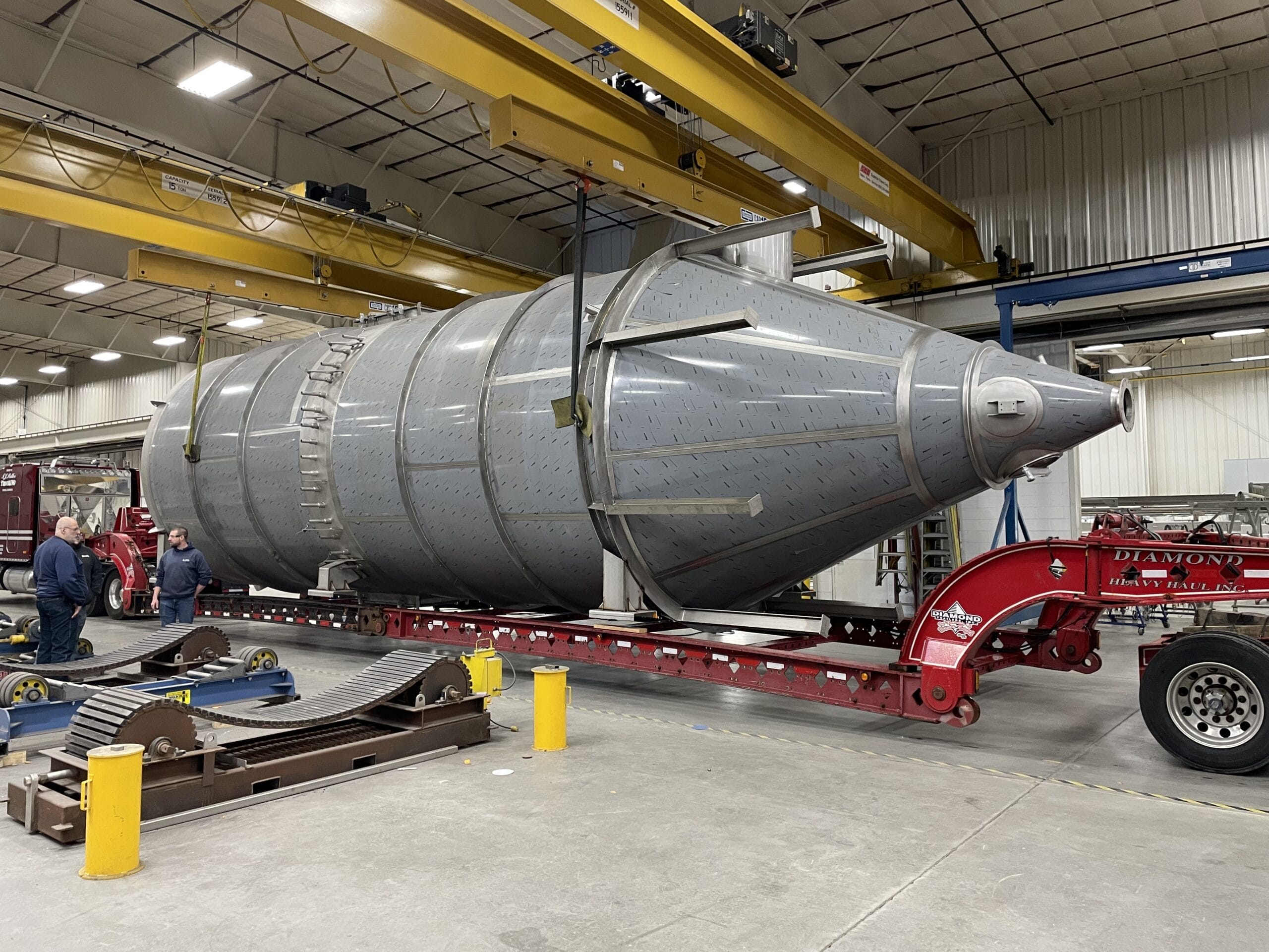 Large stainless baghouse (65' L x 16' Ø) for whey protein dairy application.