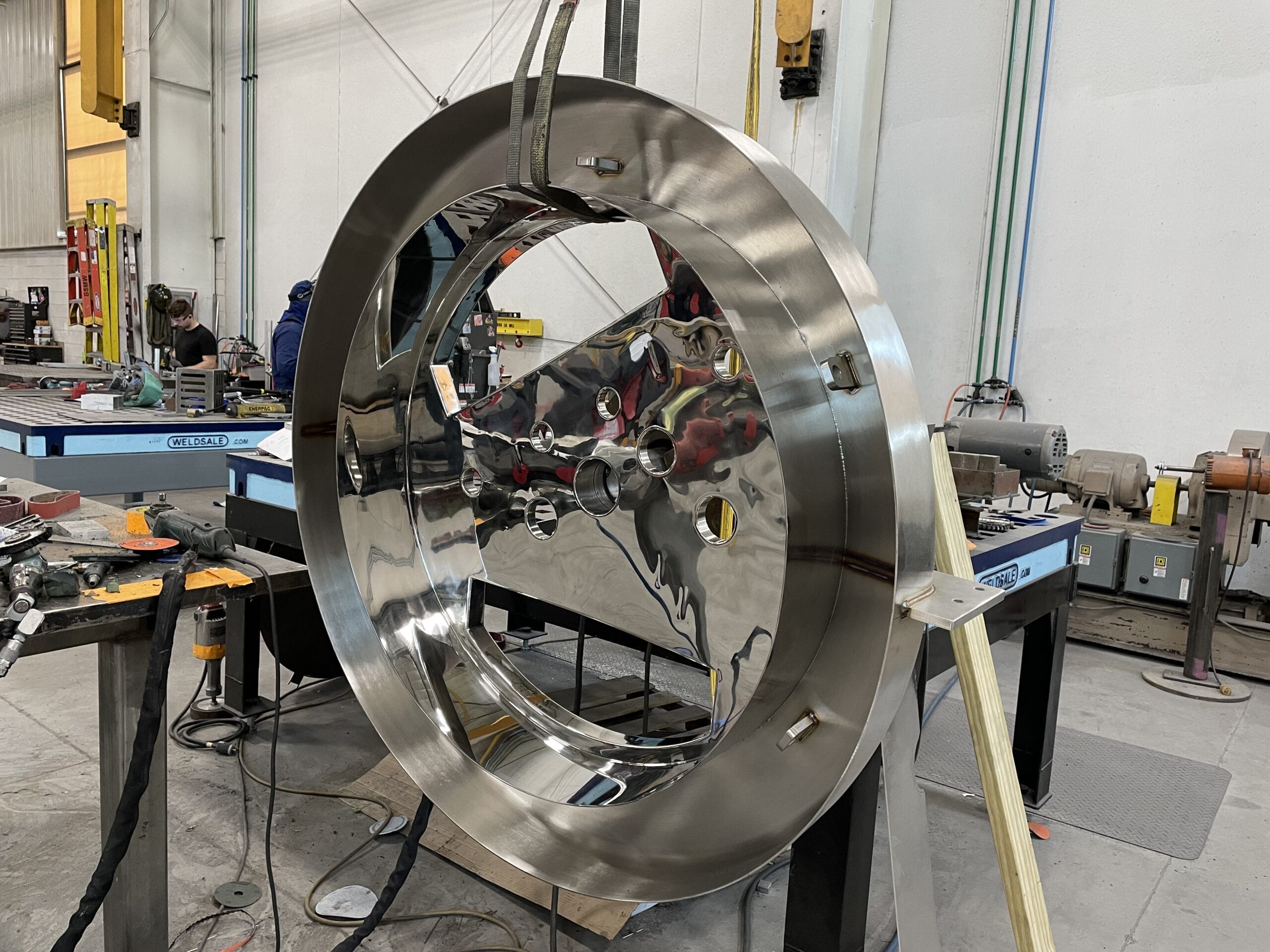 Stainless fabricated assembly with formed panels and welded construction.