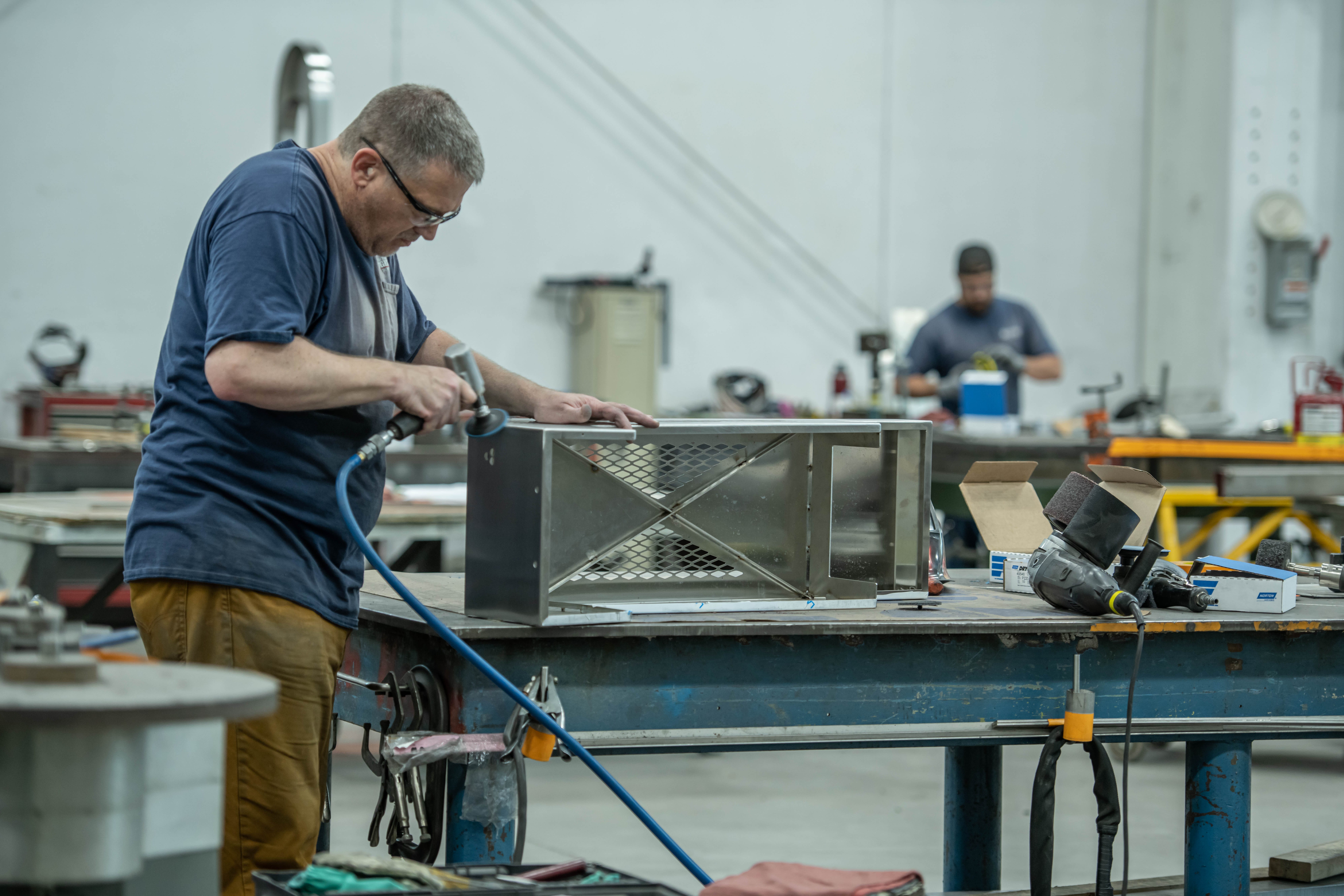 Blending and finishing stainless welds for uniform surface quality.